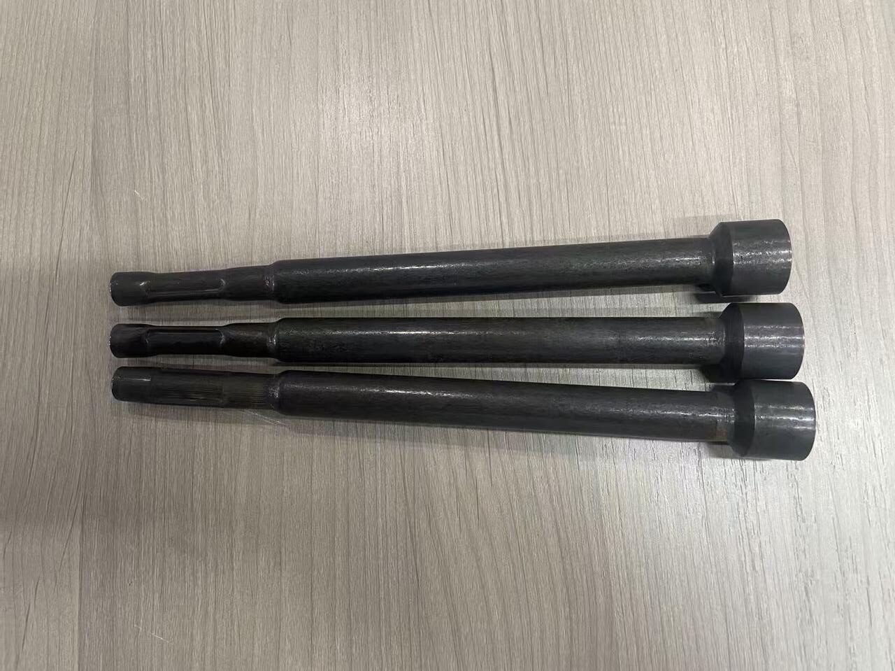Power tool extension bars with different drive and holder end geometries