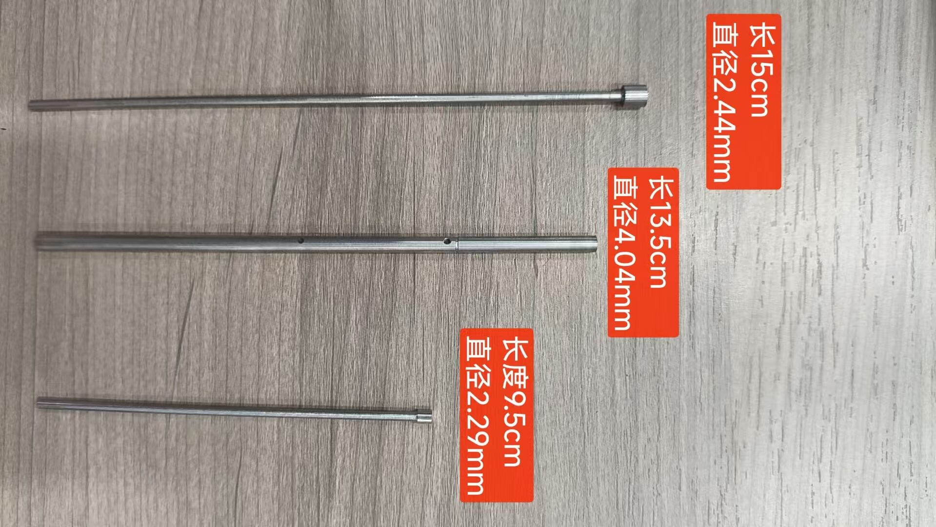 Three slender mould ejector pins with different annotated diameters and lengths