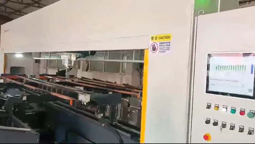 Long rock drill rods arranged on the support bed of a straightening machine