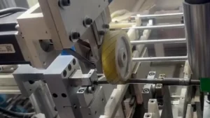 Measuring and rotating mechanism contacting a slender textile shaft